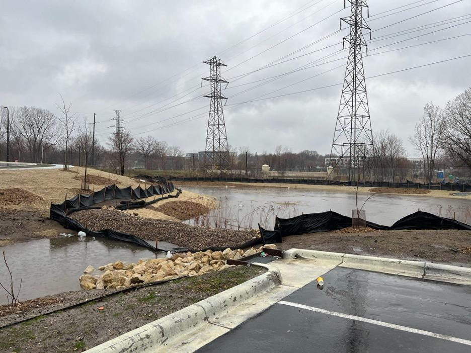 Parking lot with sediment traps, forebays, infiltration basins, rock inlets.